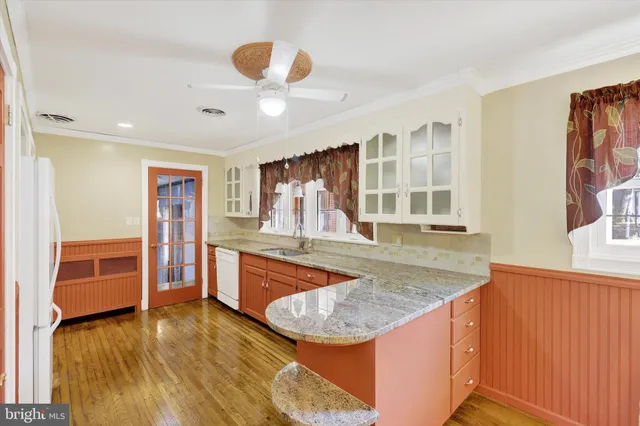 a view of kitchen island a sink and living room