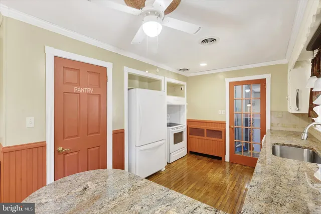 a bedroom with a bed and cabinets