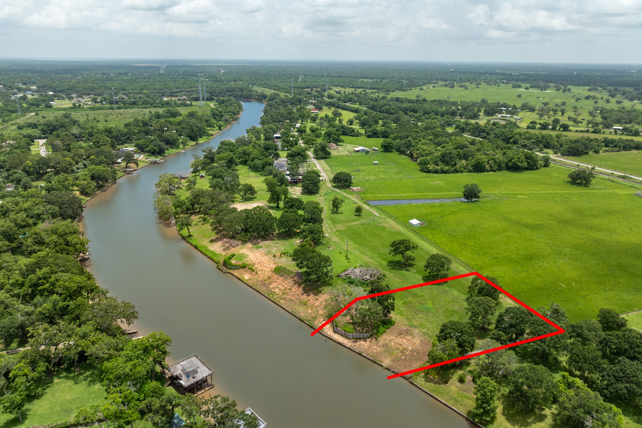4 County Road 344 Sweeny, TX 77480 - Photo 4 of 6 an aerial view of a golf course with chairs