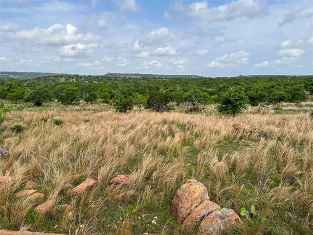 a view of a yard with table and chairs