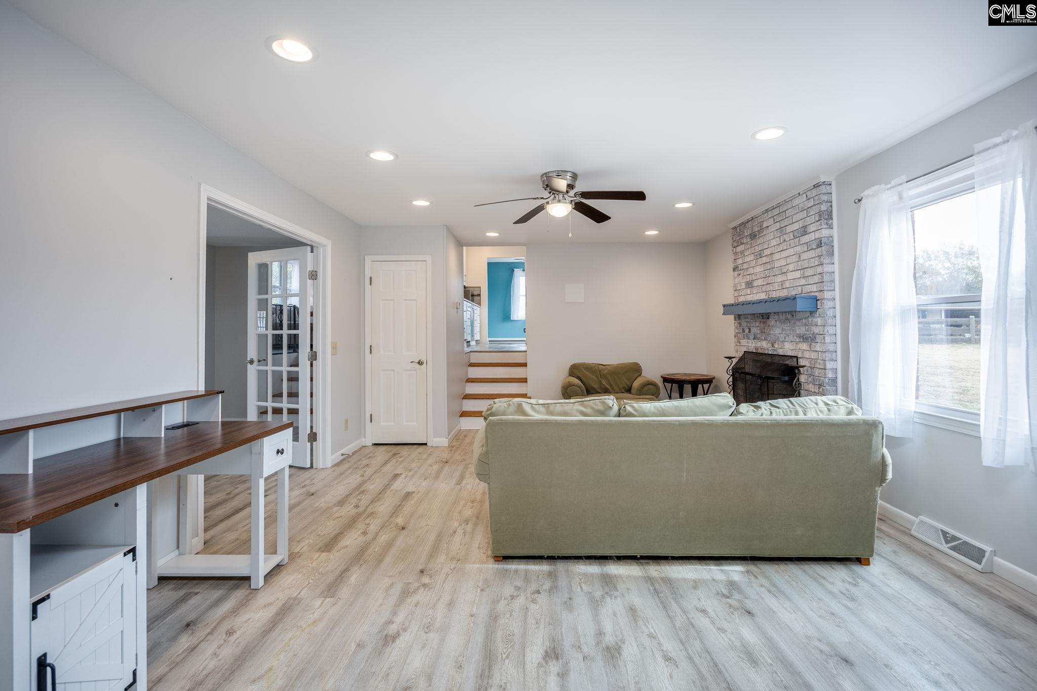 560 Edisto Street Batesburg, SC 29006 - Photo 11 of 49 a living room with furniture and a wooden floor