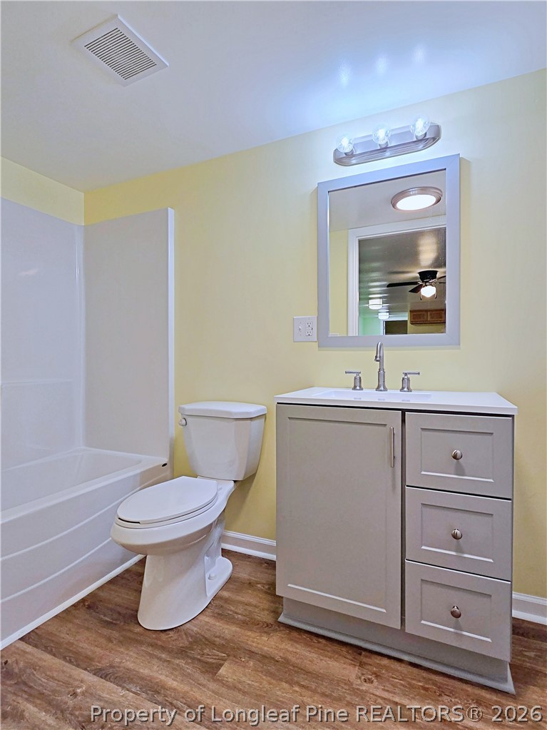 1031 Pine Acres Road White Oak, NC 28399 - Photo 18 of 29 a bathroom with a sink a toilet and a mirror