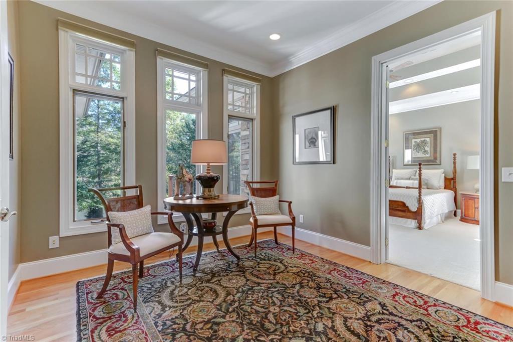 5260 Bunch Road Summerfield, NC 27358 - Photo 12 of 30 The entry to the Master Bedroom Suite provides separation and privacy from the public spaces. Wood flooring, recessed lighting, and a trio of windows to bring in natural light.