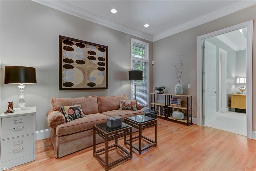 5260 Bunch Road Summerfield, NC 27358 - Photo 15 of 30 Conveniently located near the Kitchen and back hall to garage, this Sitting Room also provides a separate area for your guests or children to hang out. Hardwood flooring and recessed ceiling light fixtures.