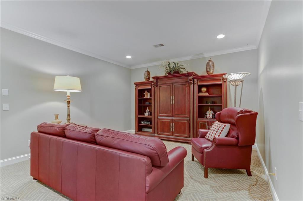 5260 Bunch Road Summerfield, NC 27358 - Photo 22 of 30 The Den on the lower level could be the perfect Home Theater.