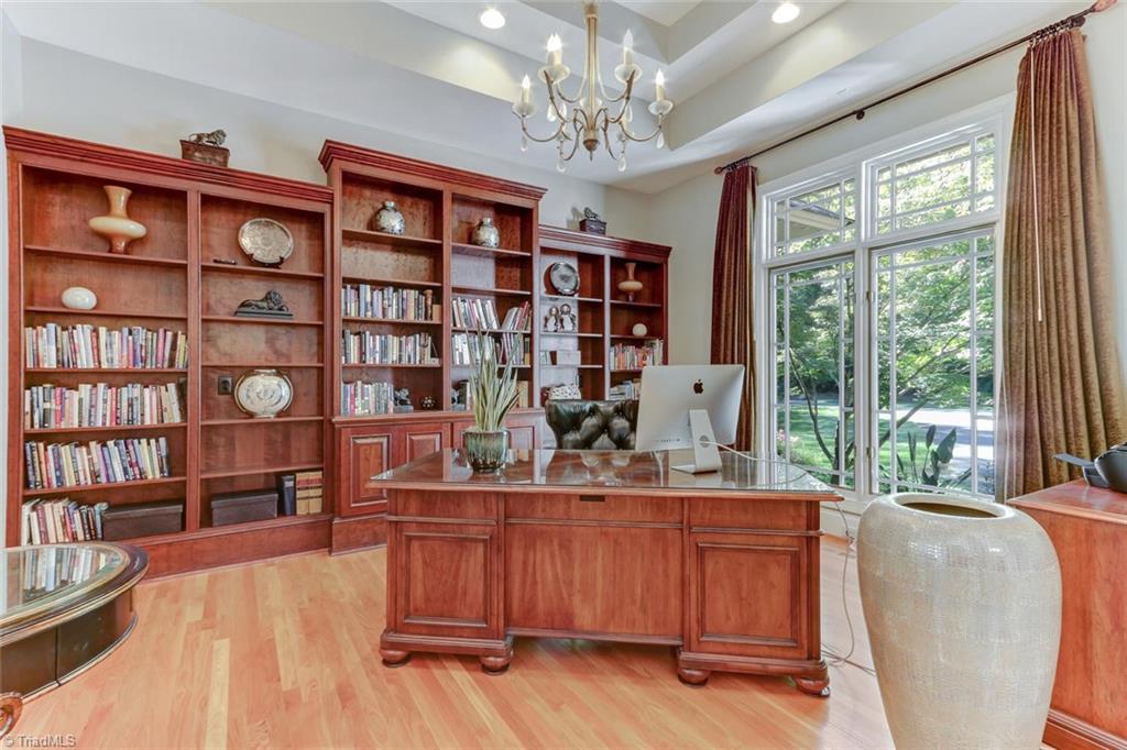 5260 Bunch Road Summerfield, NC 27358 - Photo 5 of 30 The Office. Wood flooring, double tray ceiling with recessed lighting and central chandelier. Built in open and closed storage. Views to the front motor court.
