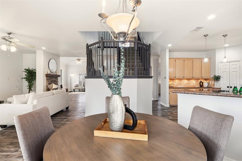 1904 Strait Lane Flower Mound, TX 75028 - Photo 11 of 33 a living room with furniture kitchen view and a chandelier