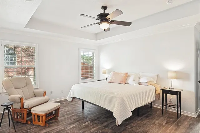 a bedroom with a bed and a couch