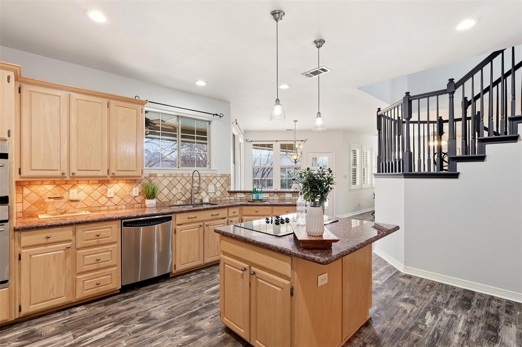 1904 Strait Lane Flower Mound, TX 75028 - Photo 12 of 33 a kitchen with stainless steel appliances granite countertop a stove and a sink