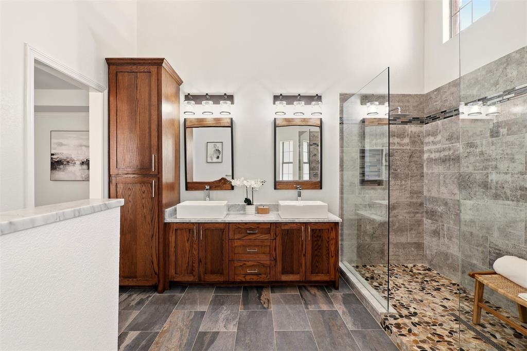1904 Strait Lane Flower Mound, TX 75028 - Photo 19 of 33 a bathroom with a double vanity sink toilet and shower