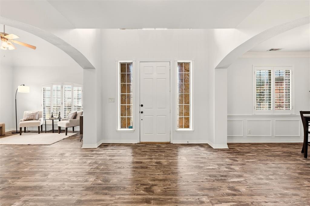 1904 Strait Lane Flower Mound, TX 75028 - Photo 2 of 33 an empty room with wooden floor and windows