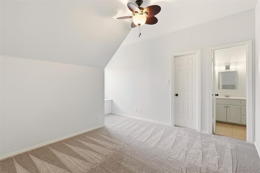 1904 Strait Lane Flower Mound, TX 75028 - Photo 23 of 33 a view of a room with a bed and cabinets