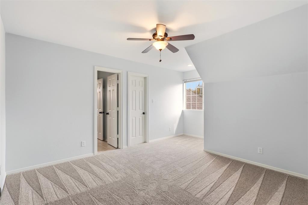 1904 Strait Lane Flower Mound, TX 75028 - Photo 24 of 33 a view of a room with a ceiling fan and window