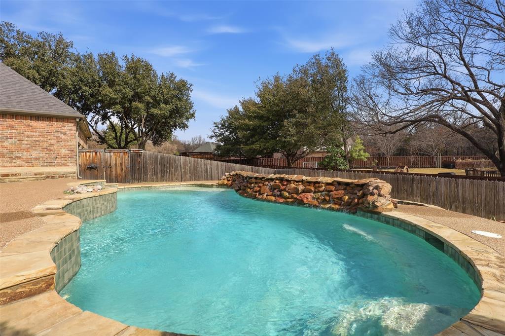 1904 Strait Lane Flower Mound, TX 75028 - Photo 27 of 33 a view of a backyard with a small pool