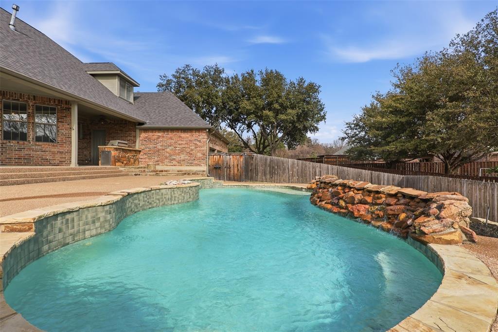 1904 Strait Lane Flower Mound, TX 75028 - Photo 28 of 33 a view of a backyard with wooden fence