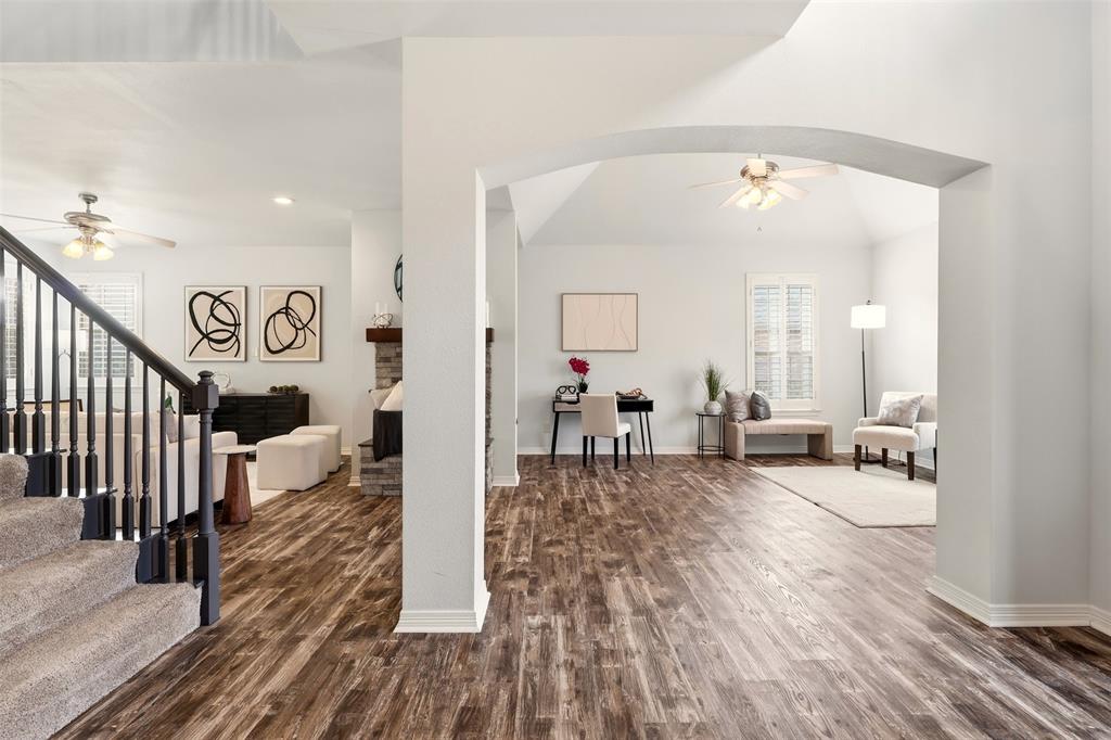 1904 Strait Lane Flower Mound, TX 75028 - Photo 4 of 33 wooden floor view with living room and window