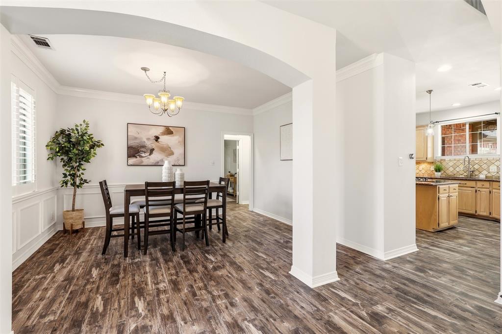 1904 Strait Lane Flower Mound, TX 75028 - Photo 6 of 33 a view of a dining room with furniture and wooden floor