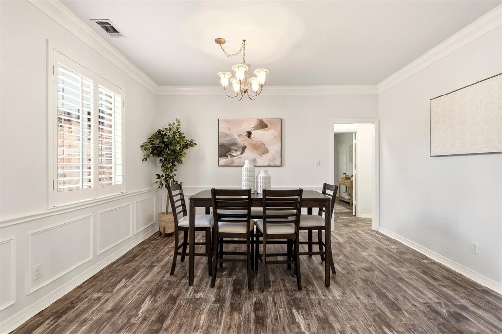 1904 Strait Lane Flower Mound, TX 75028 - Photo 7 of 33 a view of a dining room with furniture wooden floor and chandelier