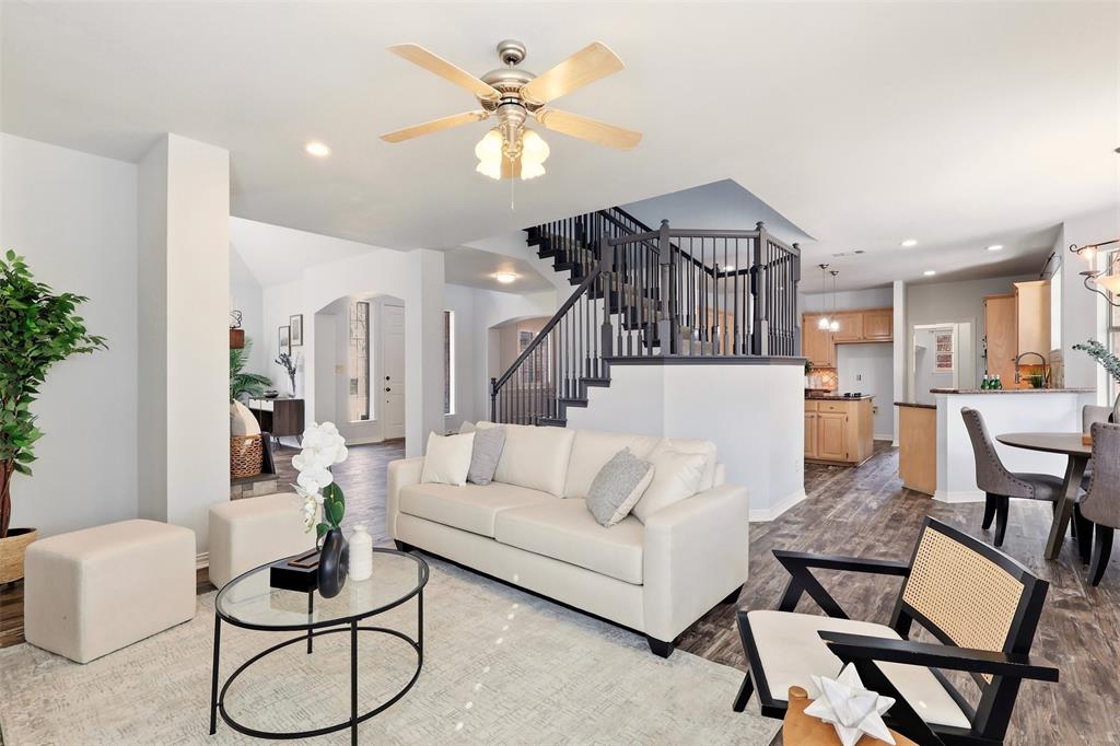 1904 Strait Lane Flower Mound, TX 75028 - Photo 9 of 33 a living room with furniture kitchen view and a chandelier