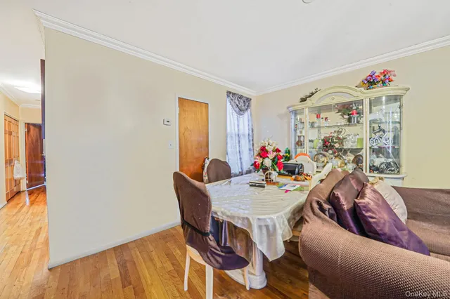 a view of a dining room with furniture and a window