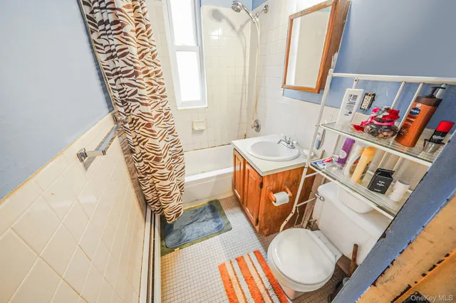 a bathroom with a sink toilet and a bathtub