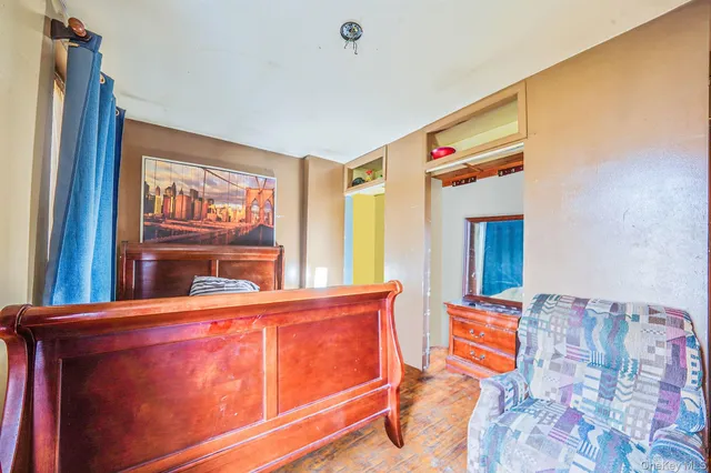 a view of a white building among the tall building