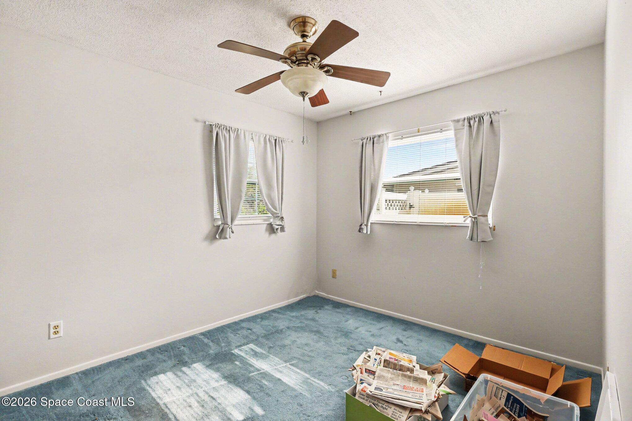 979 Kings Post Road Rockledge, FL 32955 - Photo 8 of 15 wooden floor in a room with a window