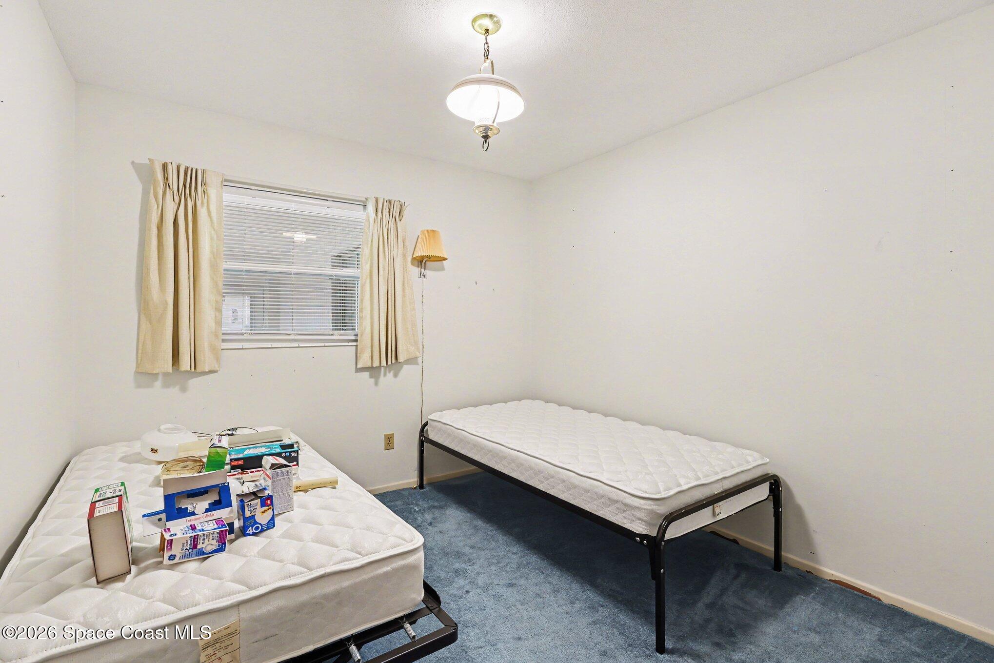 979 Kings Post Road Rockledge, FL 32955 - Photo 9 of 15 a room with furniture and a table