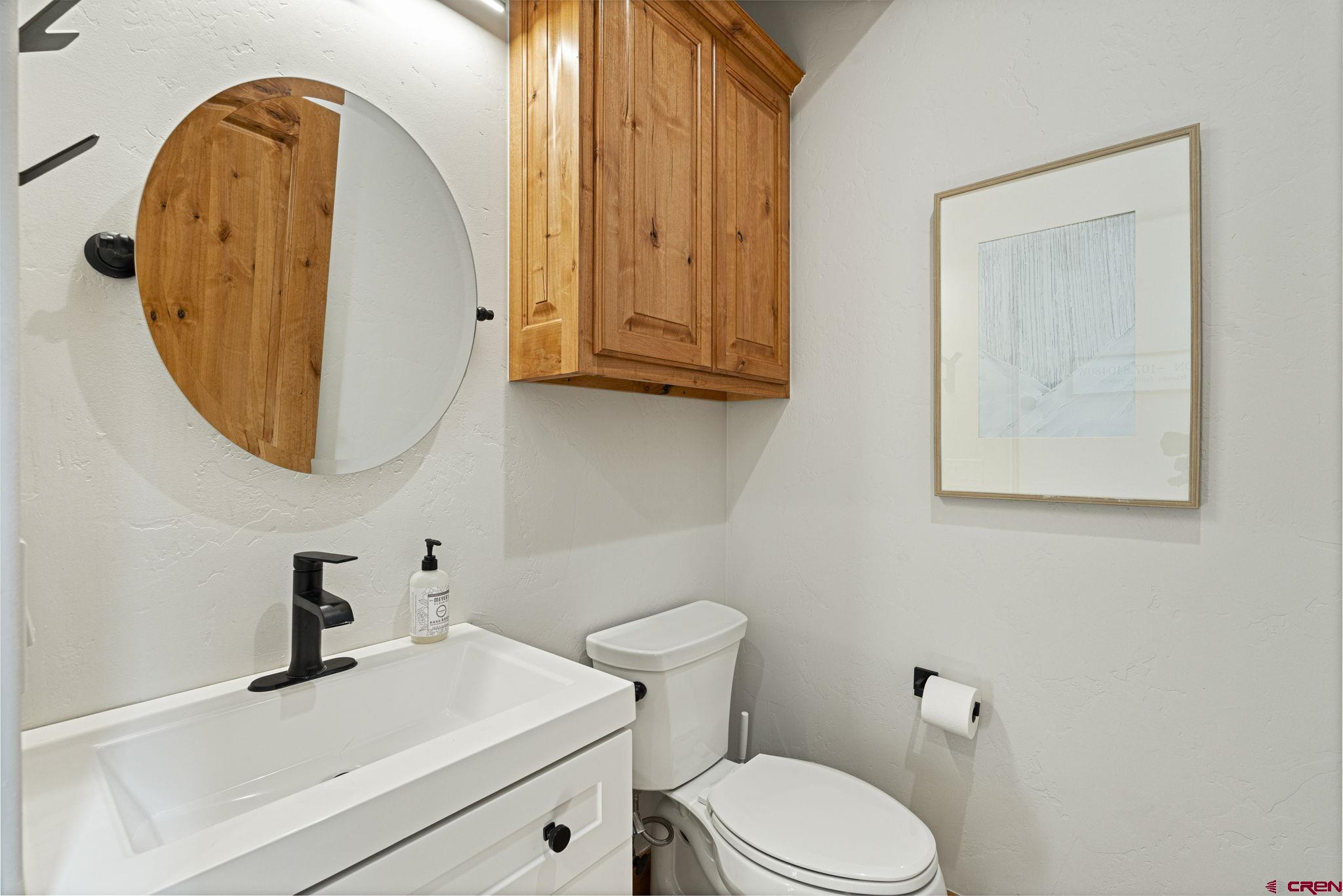 95 Turnberry Drive Durango, CO 81301 - Photo 16 of 36 a bathroom with a sink a mirror and a toilet