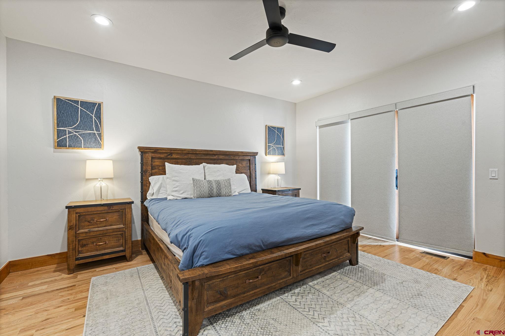 95 Turnberry Drive Durango, CO 81301 - Photo 17 of 36 a bed sitting in a bedroom and a chandelier