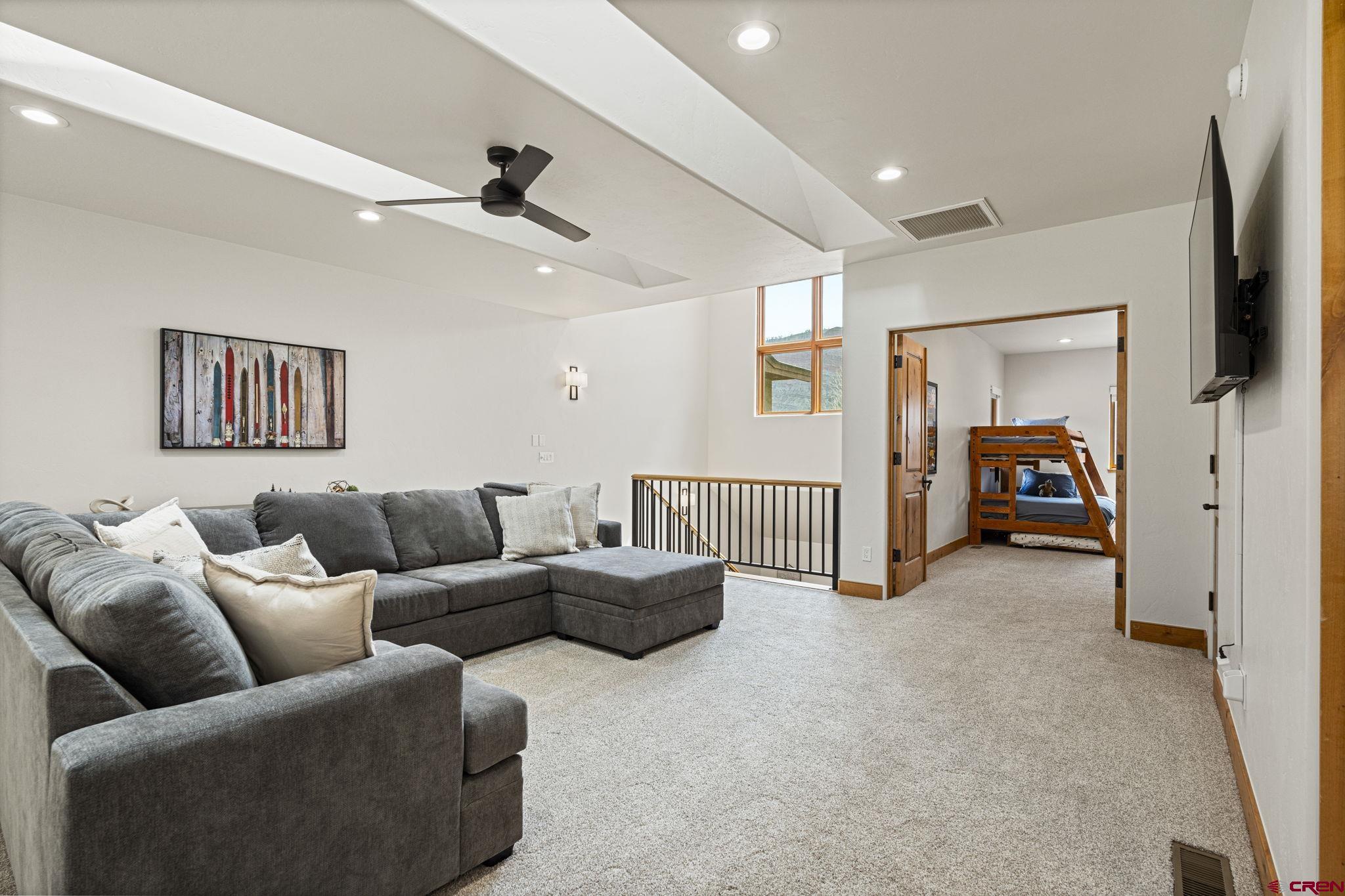 95 Turnberry Drive Durango, CO 81301 - Photo 20 of 36 a living room with furniture and a flat screen tv