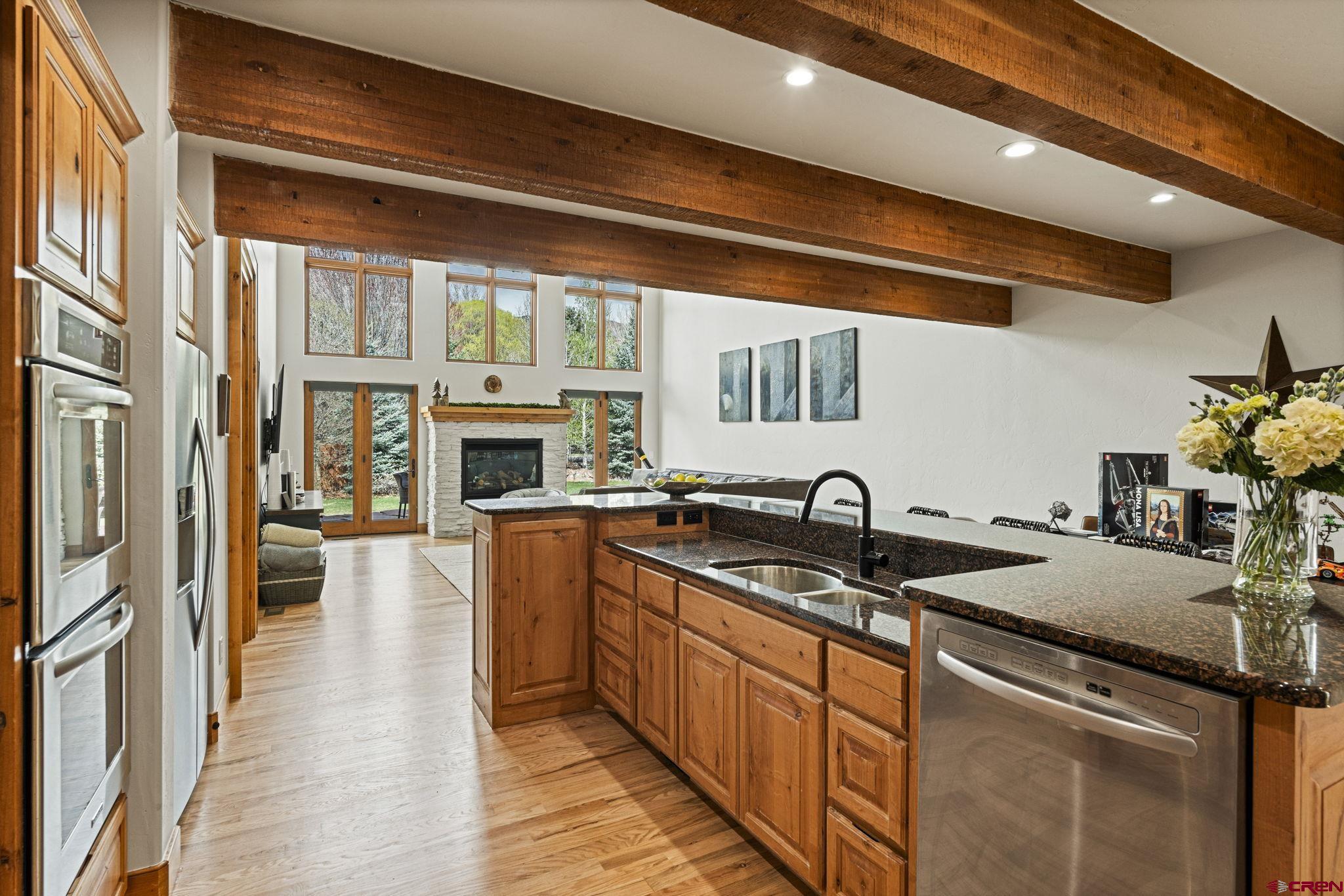 95 Turnberry Drive Durango, CO 81301 - Photo 2 of 36 a kitchen with stainless steel appliances granite countertop a stove and a sink