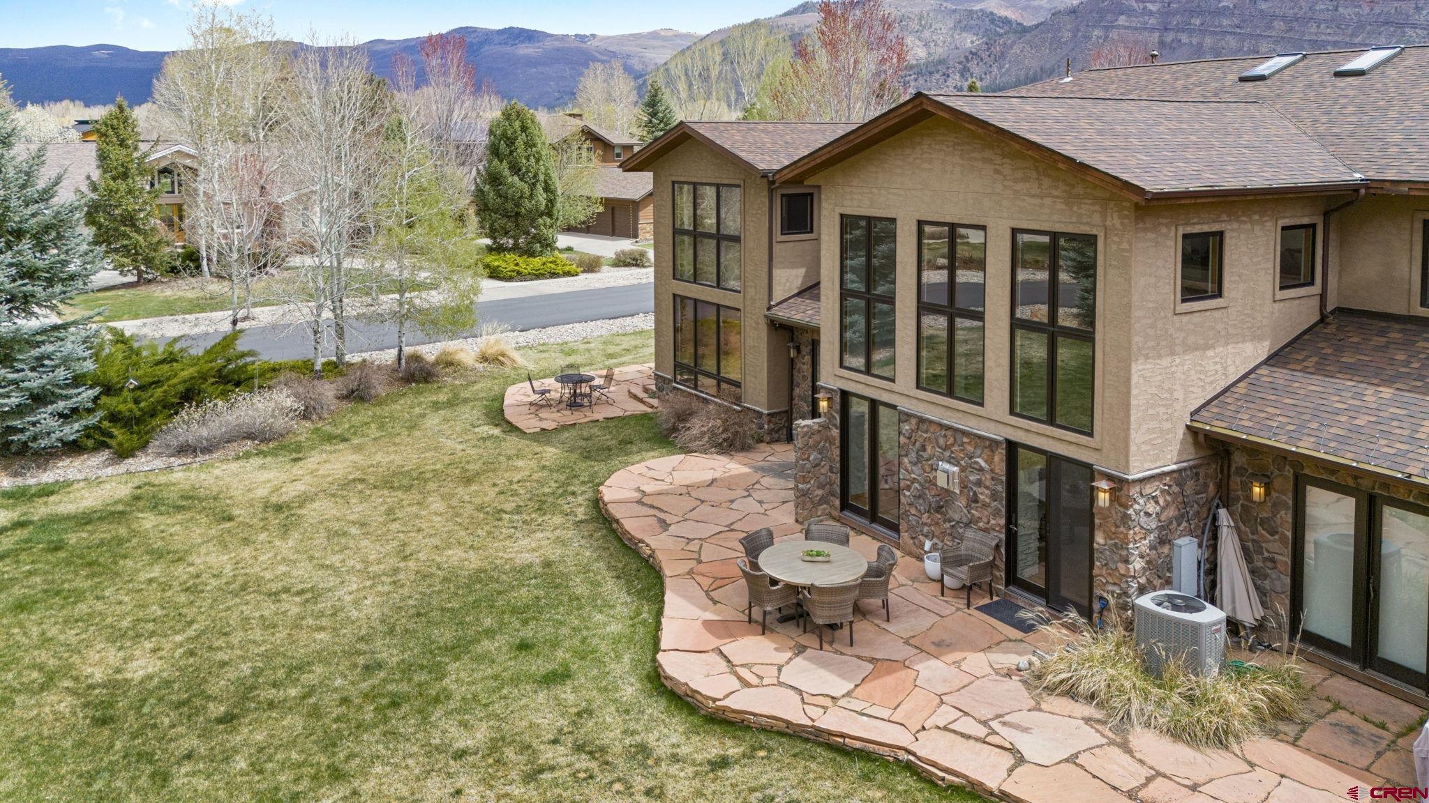 95 Turnberry Drive Durango, CO 81301 - Photo 34 of 36 a view of house with backyard outdoor seating and mountain view