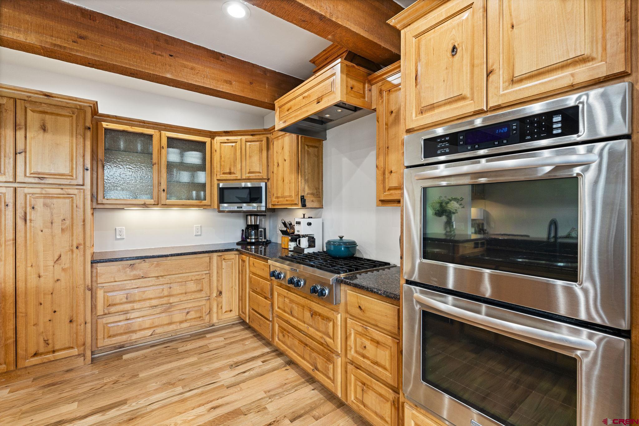 95 Turnberry Drive Durango, CO 81301 - Photo 7 of 36 a kitchen with stainless steel appliances granite countertop a stove and a microwave