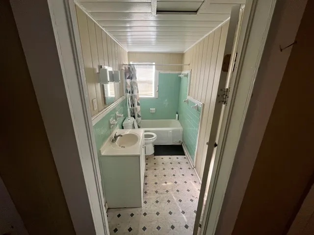 a bathroom with sink and toilet