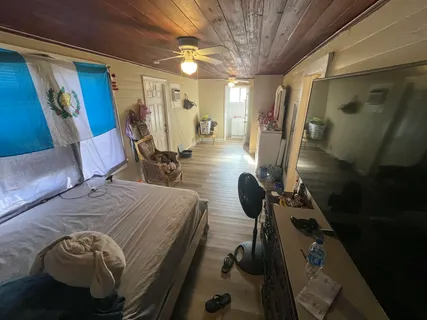 a bed room with a bed and a chair