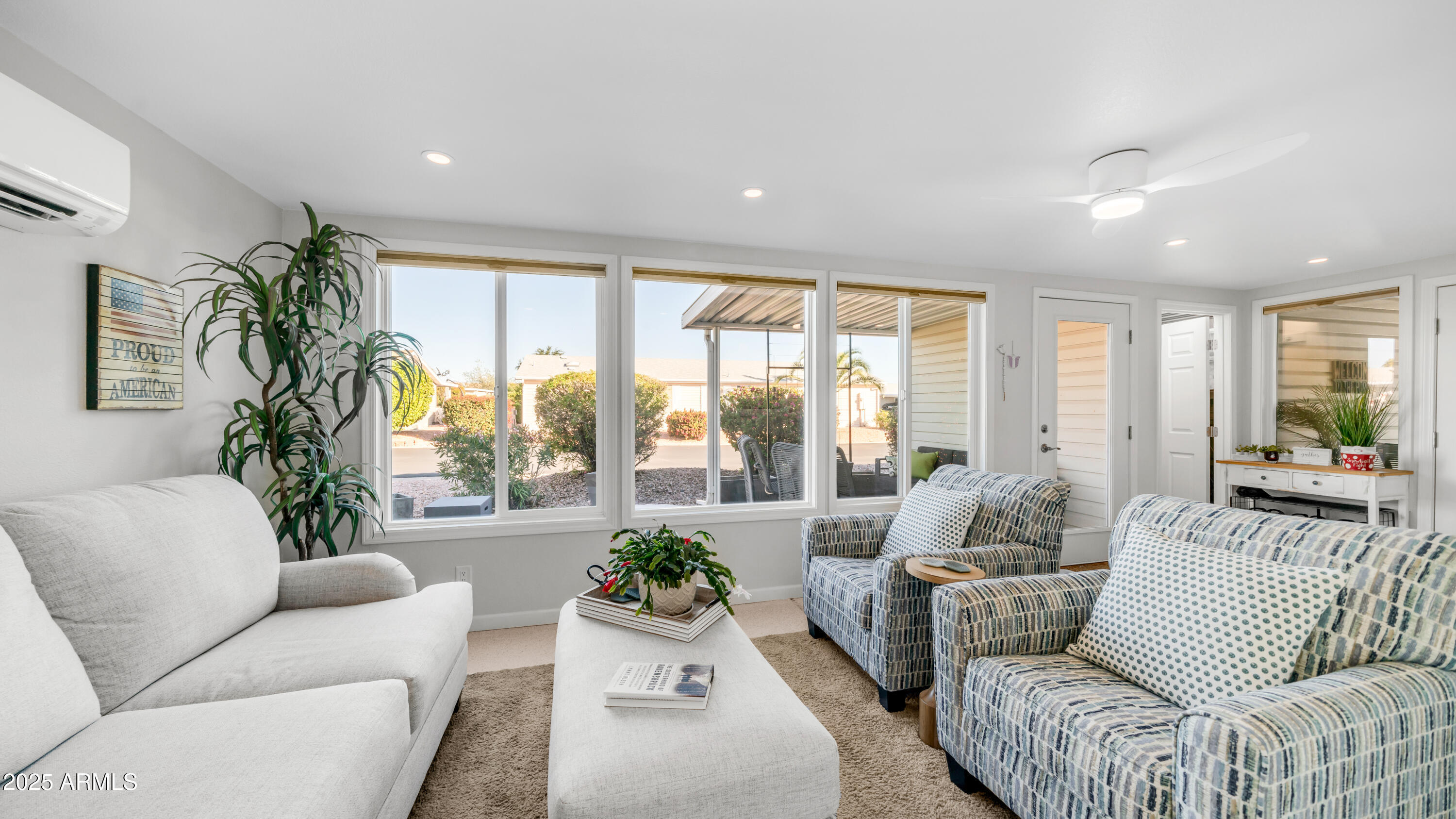 2550 South Ellsworth Road, Unit 751 Mesa, AZ 85209 - Photo 13 of 27 a living room with furniture and a large window