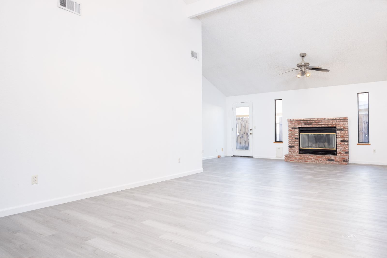 820 Walker Lane Ridgecrest, CA 93555 - Photo 10 of 27 a view of empty room with a fireplace and window