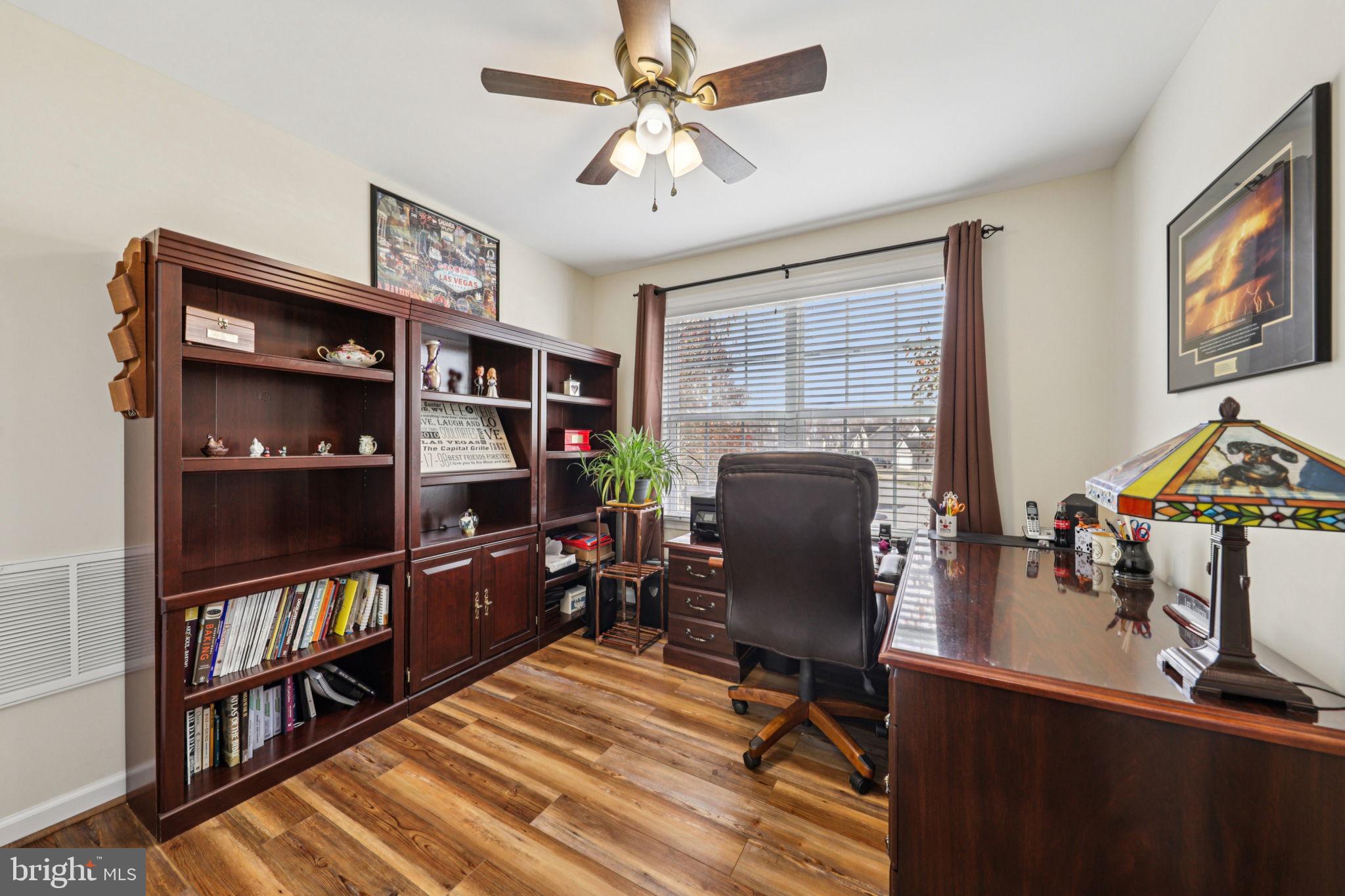 268 Shannon Court Inwood, WV 25428 - Photo 12 of 26 a view of a workspace with furniture and a bookshelf