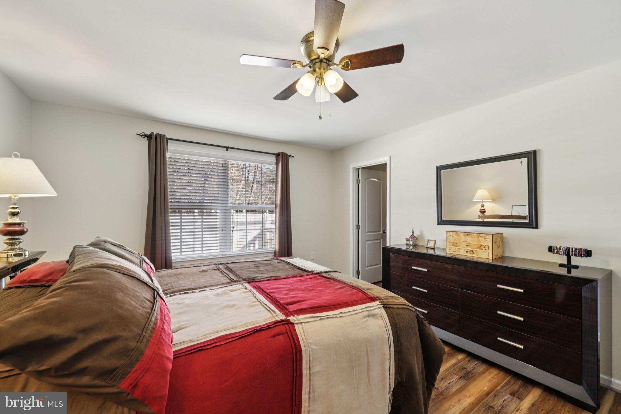 268 Shannon Court Inwood, WV 25428 - Photo 15 of 26 a bed room with a bed and a mirror