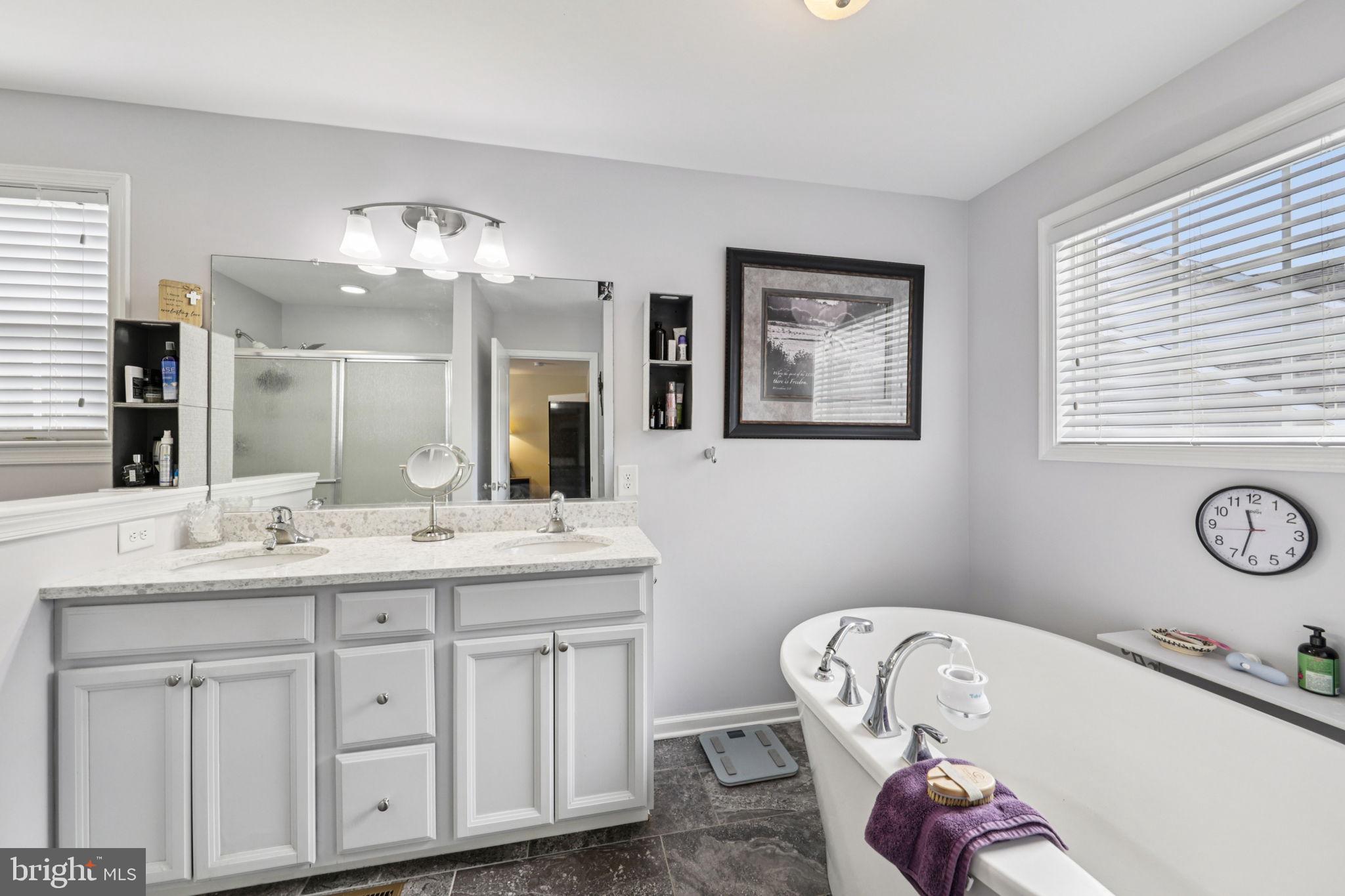 268 Shannon Court Inwood, WV 25428 - Photo 16 of 26 a bathroom with a tub sink and mirror