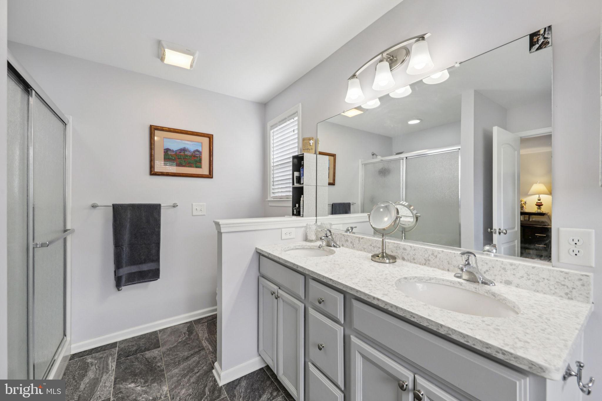 268 Shannon Court Inwood, WV 25428 - Photo 17 of 26 a bathroom with a double vanity sink and a mirror