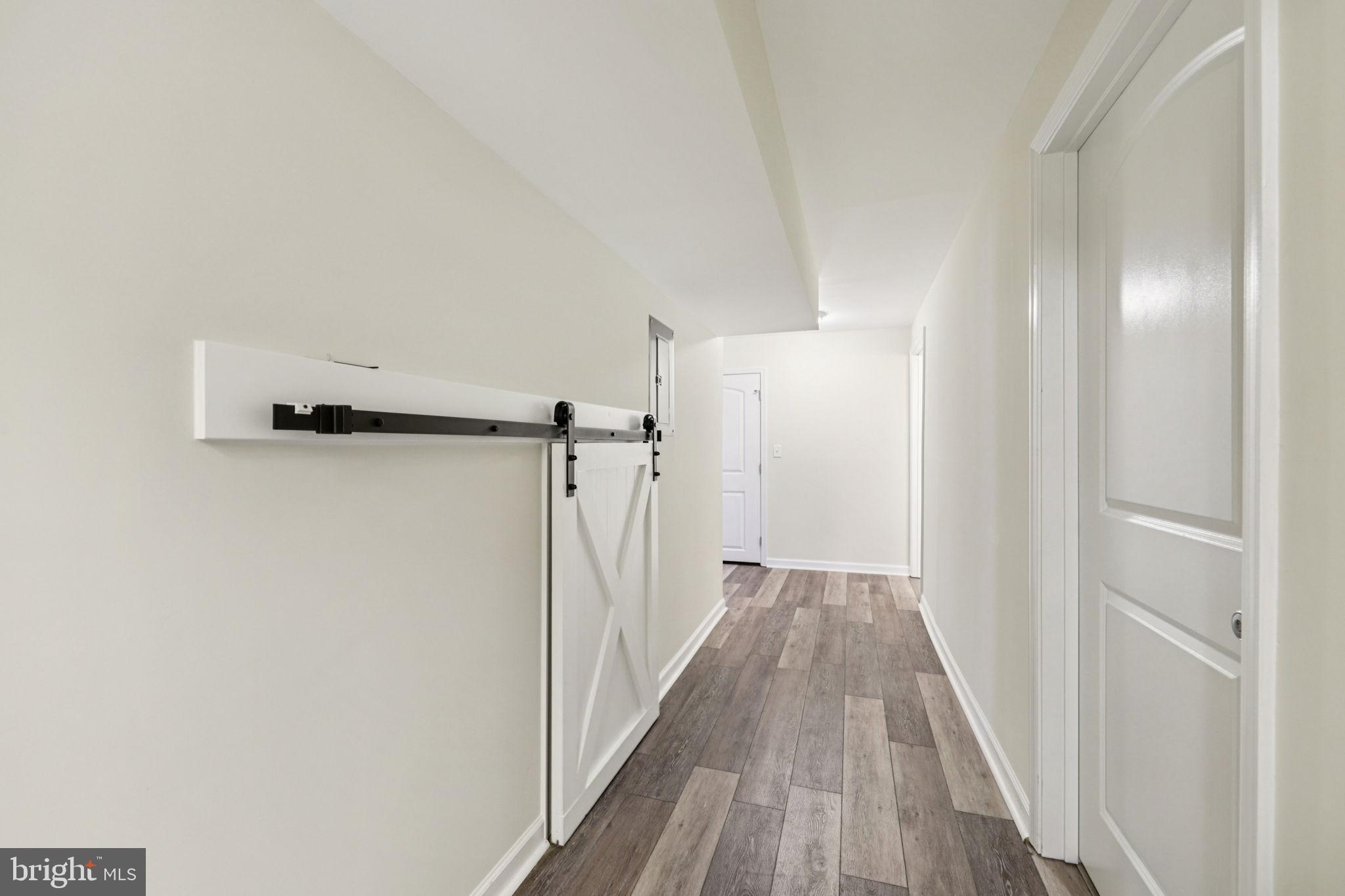 268 Shannon Court Inwood, WV 25428 - Photo 18 of 26 a view of a hallway with wooden floor