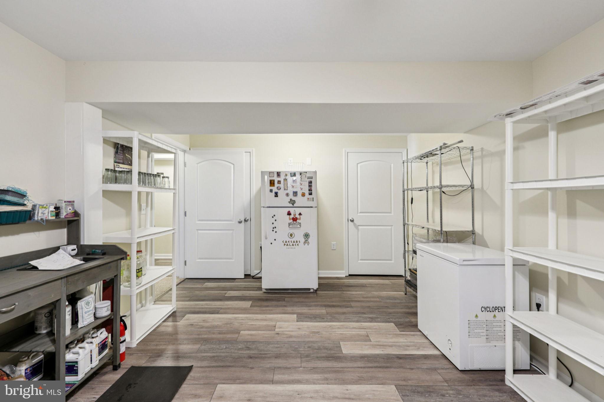 268 Shannon Court Inwood, WV 25428 - Photo 20 of 26 a view of a kitchen with fridge and wooden floor