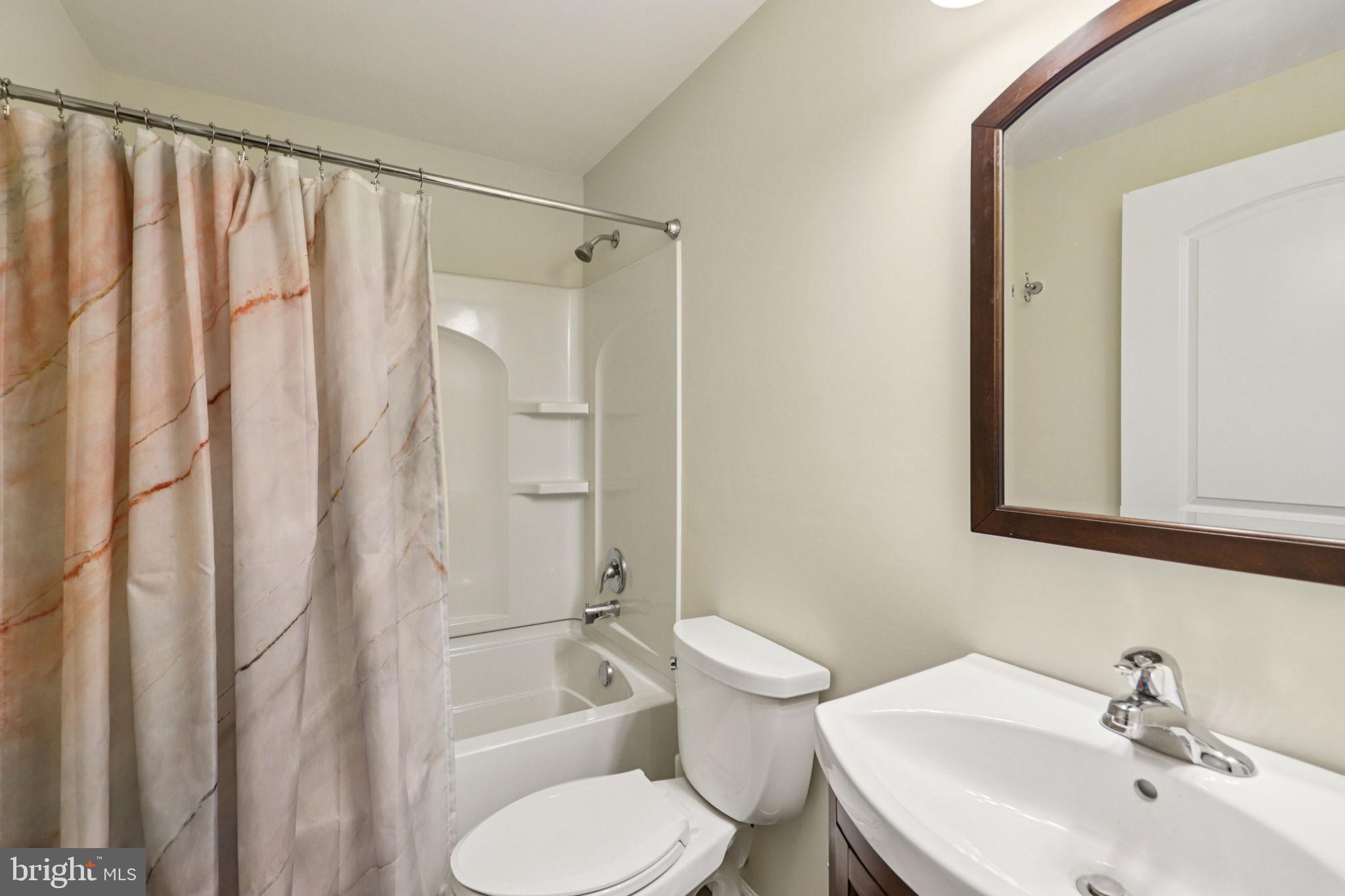 268 Shannon Court Inwood, WV 25428 - Photo 21 of 26 a bathroom with a toilet sink and shower