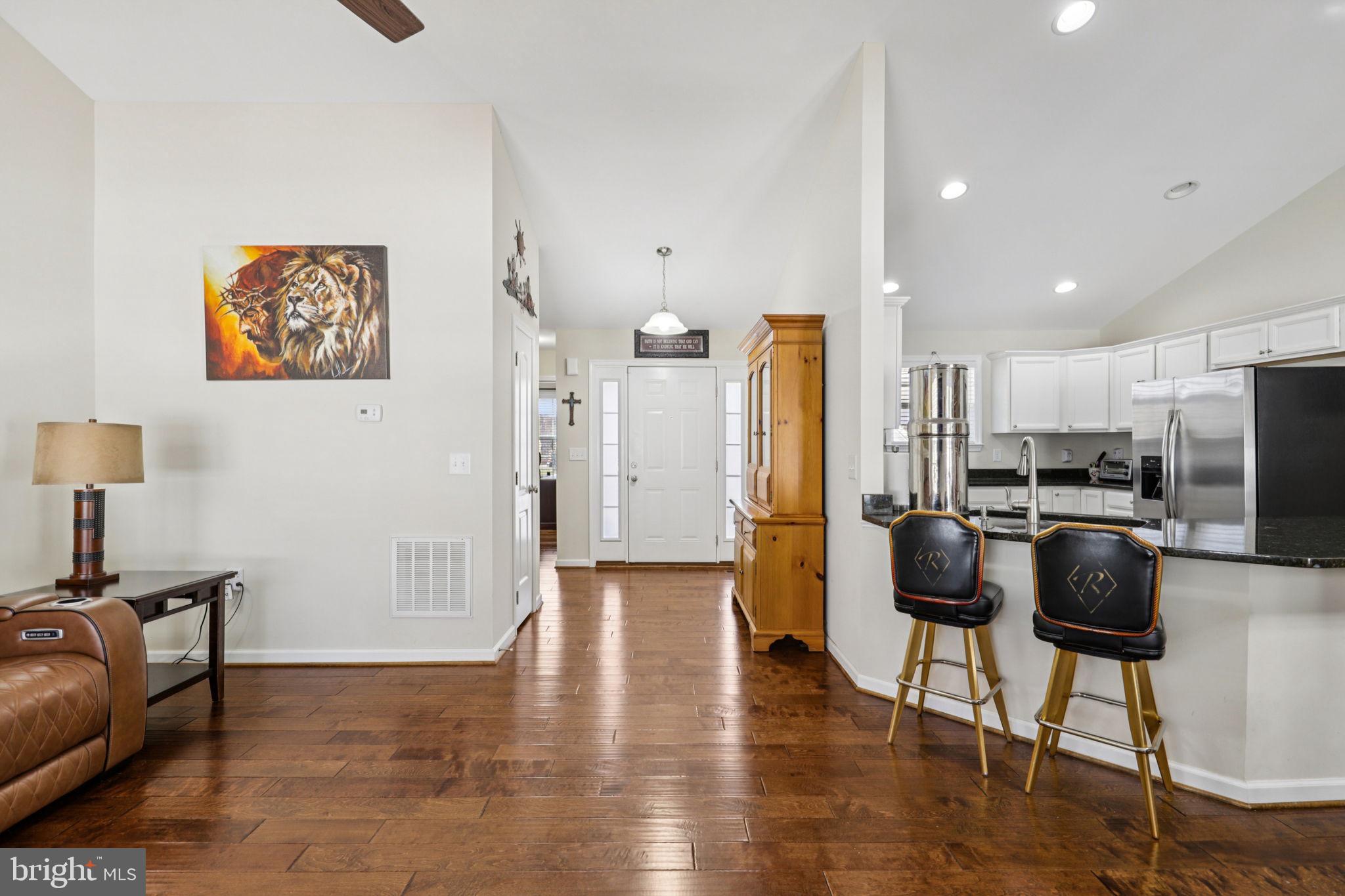 268 Shannon Court Inwood, WV 25428 - Photo 7 of 26 a view of kitchen with stainless steel appliances refrigerator stove microwave and chair