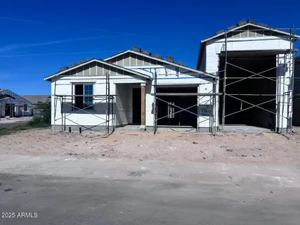 a view of a wooden house with a yard