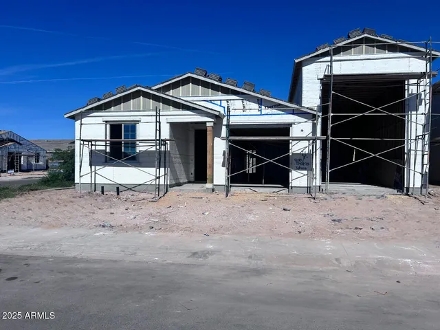 a view of a wooden house with a yard