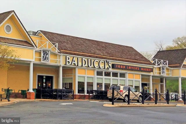 a group of people sitting in front of a building