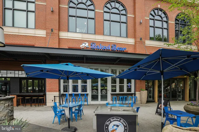 a view of a cafe with sitting area